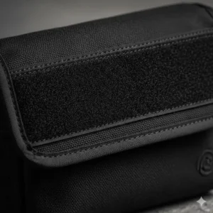 A close-up illustration focusing on the heavy-duty fabric and hook-and-loop texture of the velcro pouch.