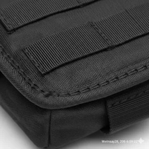 Close-up shot of the water-resistant fabric and reinforced stitching on a molle tool pouch.